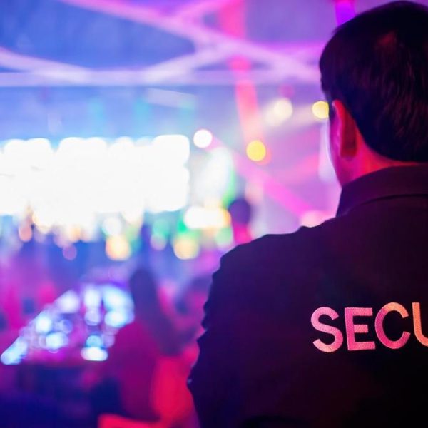 Security guard  are regulating the situation of safety in an event concert in a nightclub.